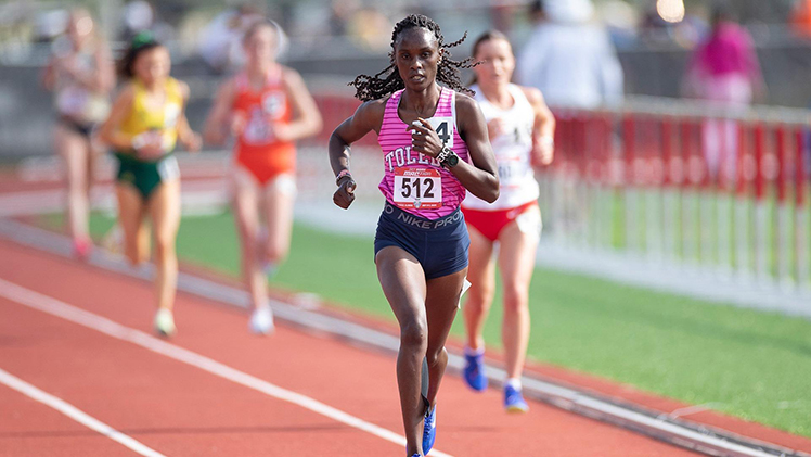 Photo of UToledo track freshman Mercy Kinyanjui during a race MAC Championships.