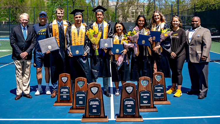 UToledo President Gregory Postel presented diplomas to the senior class members of the Toledo women’s and men's tennis teams who will be competing in the NCAA tournament at the same time as commencement ceremonies this weekend.