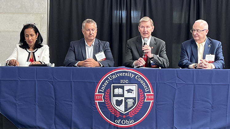 Group photo with Dr. Bill McCreary, far right, UToledo’s chief information and chief technology officer, sitting behind a table with others at Ohio’s first Artificial Intelligence Symposium earlier this month in Columbus.