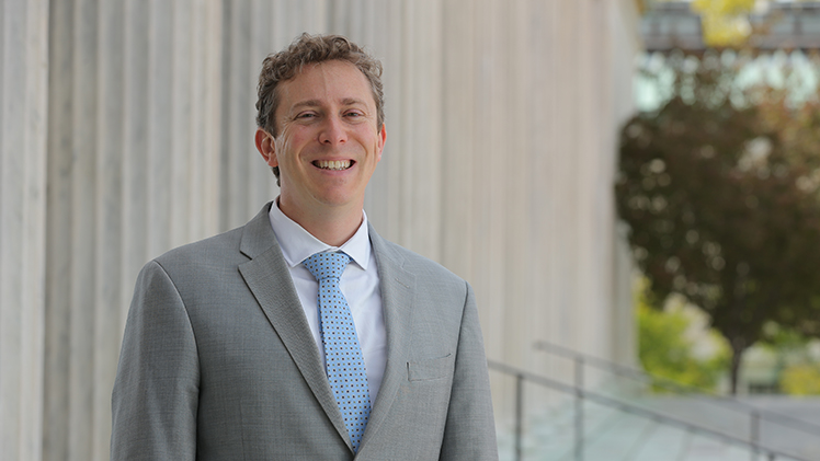 College of Law Professor Evan Zoldan poses at the Front Entrance of the Toledo Museum of Art (TMA)