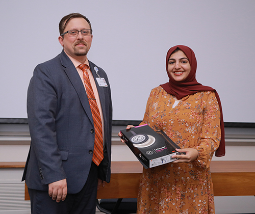 UTMC staff nurse Alishbah Shoib, right, poses with Kurt Kless, the chief nursing officer at UTMC, at the hospital's nursing residency graduation ceremony on Thursday, July 18. Shoib was one of 25 registered nurses in the yearlong residency program's first cohort.