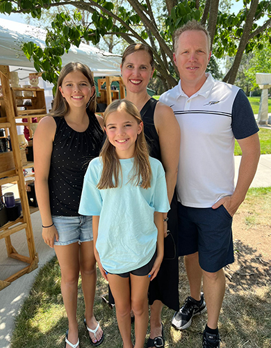 Posing for a photo are UToledo Interim President Matt Schroeder and his family, who were among the thousands of attendees at the annual event, sponsored by The University of Toledo Alumni Association.