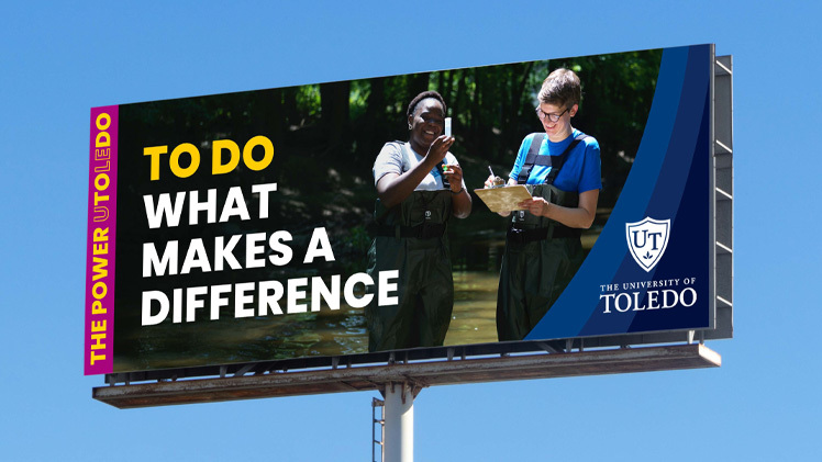 Photo of an electronic billboard with the words "To Do What Makes a Difference," which is part of the UToledo's new brand launch, The Power to Do.