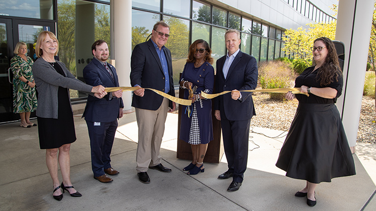 The University of Toledo Business Incubator formally opened its Ohio APEX Accelerator with a ribbon-cutting ceremony on Thursday, Aug. 22. From left are Jeanine Bragg, operations manager of the UToledo Business Incubator; Joey Scott, Ohio APEX Accelerator statewide manager; David Richardson, program coordinator for the Ohio APEX Accelerator at UToledo; Pamela Moore, director of the UToledo Business Incuabator; Matt Schroeder, interim president of UToledo, and Kristen Shinaver, social media and brand development manager of the UToledo Business Incubator.