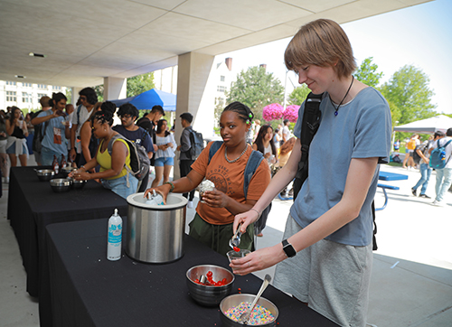 Tori Ricks, an environmental science sophomore, puts a cherry on top of her ice cream.