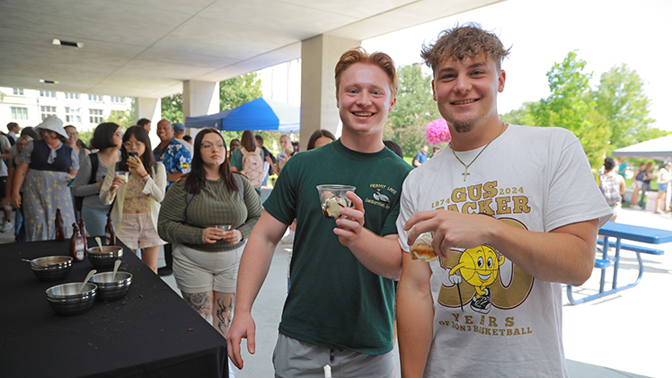 Jonathan Cerar, left, and Joshua Young, both second-year physical therapy students, show off their sundae creations.