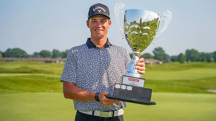 Former Rocket Barend Botha continued his red-hot start to his professional career on the PGA Americas Tour by winning his second-straight tournament with a one-shot victory at the BioSteel Championship. In this photo he is holding a large trophy for winning the event.