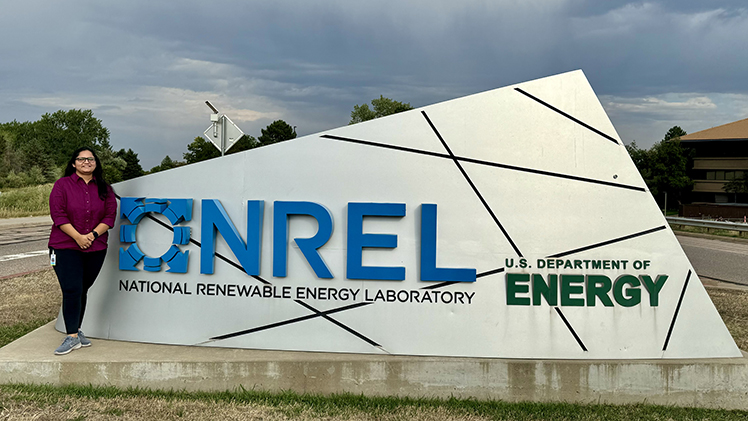 Aesha Patel, a Ph.D. student in UToledo's Department of Physics and Astronomy, began a prestigious internship at the National Renewable Energy Laboratory (NREL) earlier this year and is posing in front of the large NREL sign outside of the research lab's headquarters in Colorado.