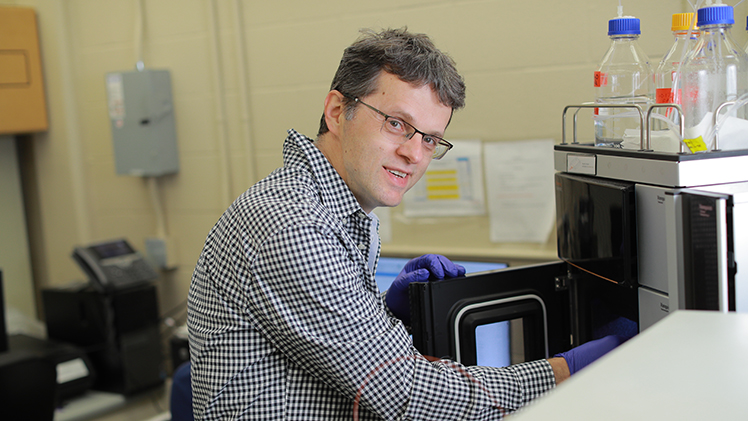 Dr. Dragan Isailovic, a professor in the Department of Chemistry and Biochemistry at The University of Toledo, poses for a photo in his research lab.