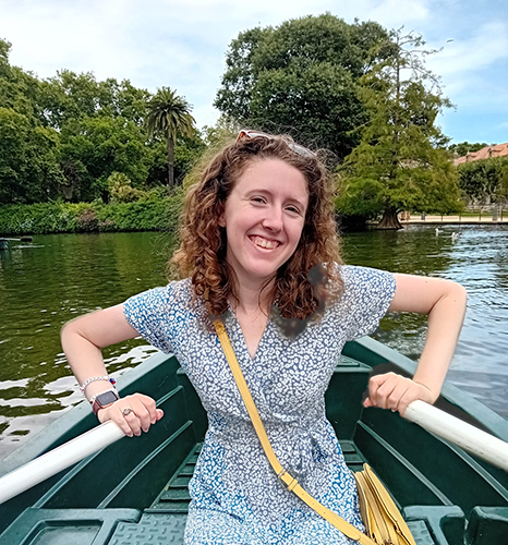 Nina Ligman poses for a photo in a rowboat on a river in Spain.