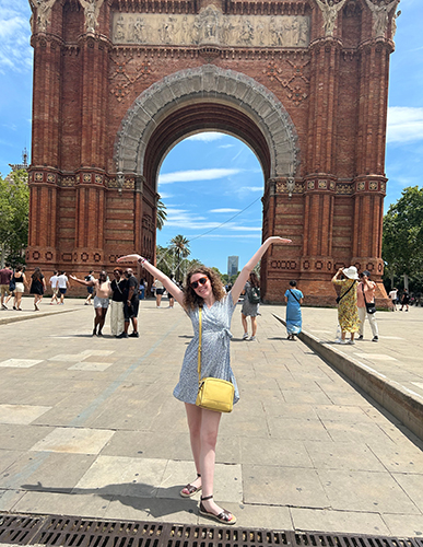 Nina Ligman, a senior studying English with a focus on creative writing, poses in front of the Arc de Triomf in Barcelona, Spain, where she spent her summer educating students in a second language and earning a teaching certificate in the process.