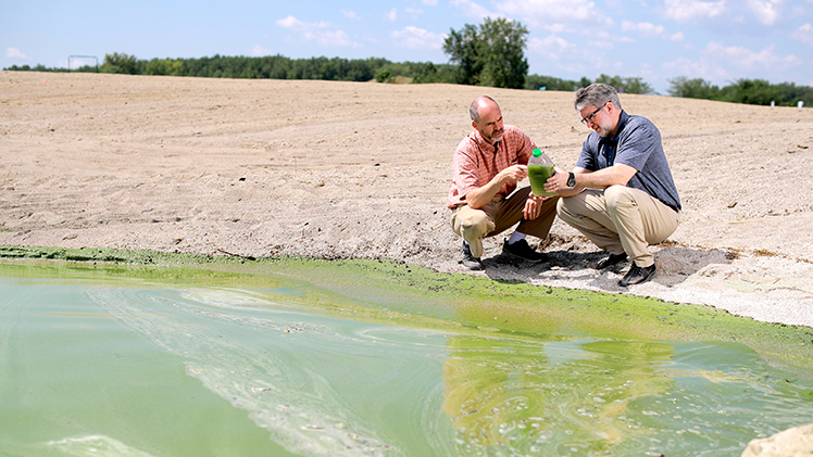 UToledo molecular biologists Dr. Steven Haller and Dr. David Kennedy examine the health effects of airborne algal toxins at Lake Erie.