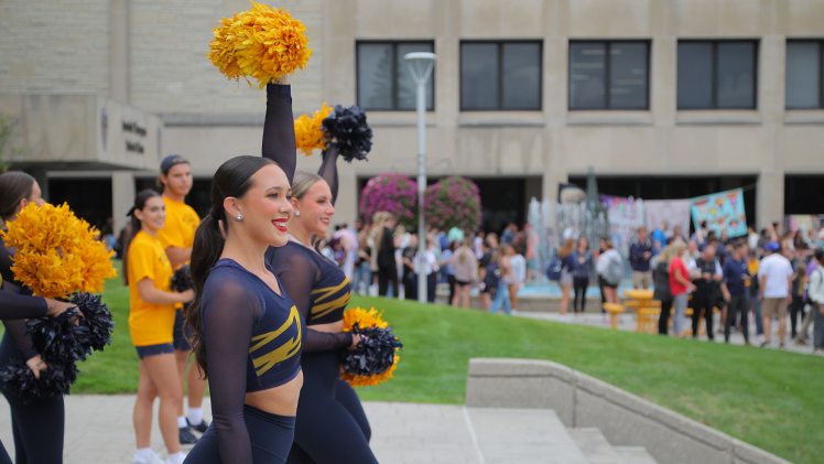 Photo of UToledo cheerleaders during the 2024 Homecoming pep rally on Centennial Mall.