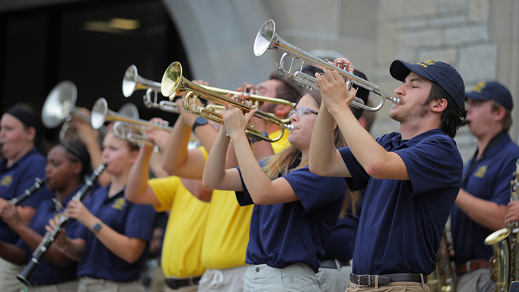 Horn players in the UToledo band perform during the Homecoming 2024 pep rally.