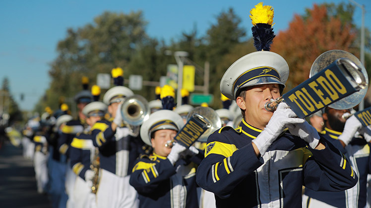 Music and excitement fill the Old Orchard neighborhood near UToledo on Saturday morning as the Rocket Marching Band helps lead the annual Edward C. and Helen G. Schmakel Homecoming Parade.