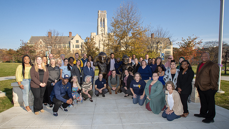 UToledo students, faculty and staff who are or were first-generation college students pose for a group photo Wednesday on the new Mascot Plaza as part of the University's celebration of first-generation college students.