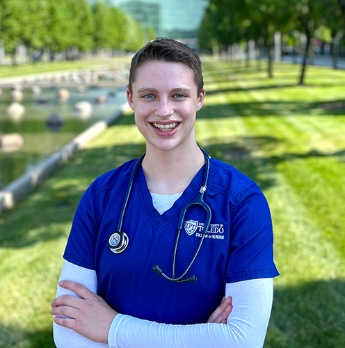 Outside portrait of Anna Bredernitz, 20, in her UToledo nursing uniform. She is scheduled to receive her bachelor’s degree in May after only two years as a Rocket.