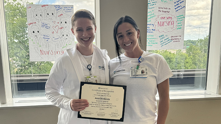 Anna Bredernitz, 20, a senior nursing student, left, gained hands-on experience last summer as a nurse associate extern at the Cleveland Clinic Main Campus in Cleveland. She is holding a certificate of completion from Cleveland Clinic.