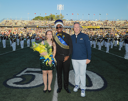 During halftime of the game, the Homecoming 2024 King and Queen, Marquan Denby and Mai Mang, were recognized by Interim President Schroeder on the football field.