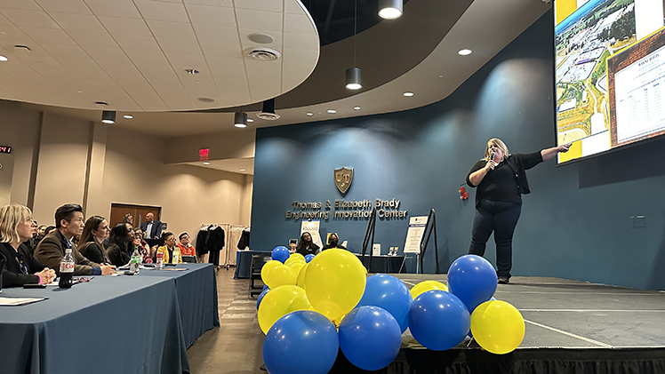 Joyce Kilpatrick, with TackBox, a northwest Ohio start-up that developed a digital marketplace for equine show vendors and competitors, pitches her technology to a panel of judges Thursday evening at the UToledo Business Incubator’s Tech419.