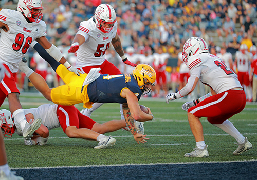 Toledo Junior Quarterback, Tucker Gleason, dives for the end zone during the 2024 Homecoming Game.