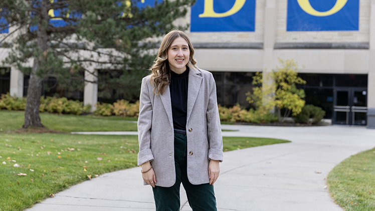 Outside portrait of graduating environmental science senior Madeline Shumaker.