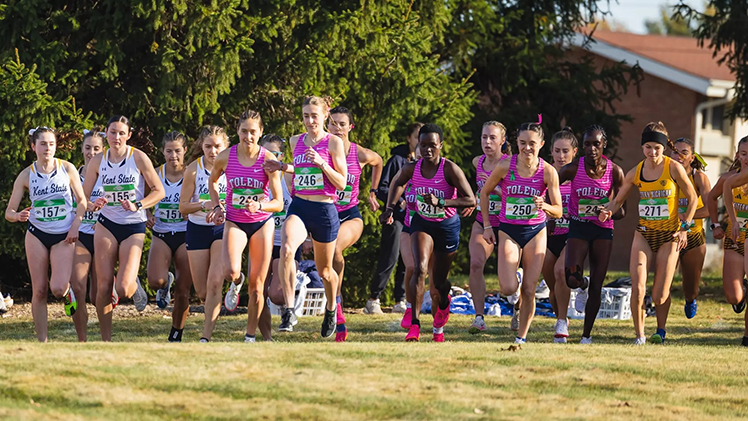 Photo of the Toledo women's cross country team just beginning an event.