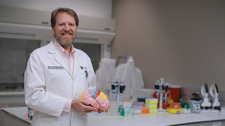 Portrait of Dr. Robert Smith, professor and chair of the Department of Neurosciences and Psychiatry, in his research lab.