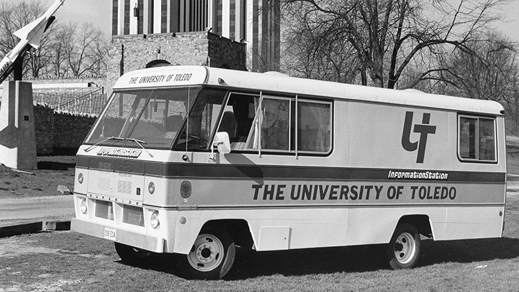 Black-and-white photo of UToledo's “InformationStation,” a 22-foot mobile vehicle gift to the University from the Sheller-Globe Corp. of Toledo on April 17, 1974, to help with recruitment of high school students.