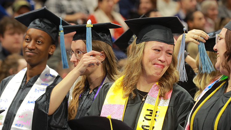 Karen Ann DuRocher gets emotional after receiving her bachelor of education degree from the Judith Herb College of Education during The University of Toledo's morning fall commencement ceremony on Saturday, Dec. 14, in Savage Arena.