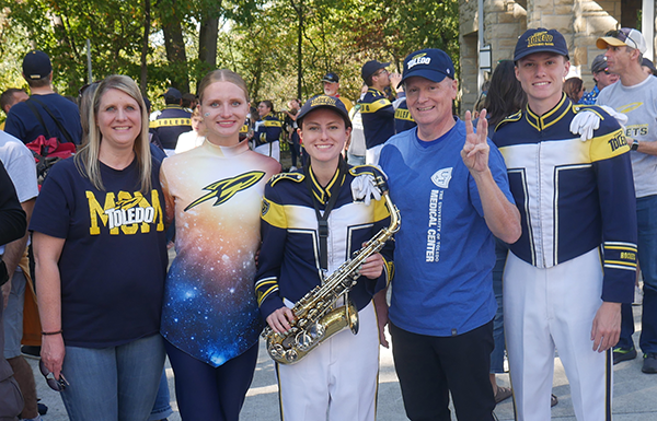 Kendall Miller, center, who graduates Dec. 14 with a bachelor's degree mechanical engineering, poses with her family: mom, Deborah Givens, and dad, Marc Miller, who graduated from UToledo in 1995 and 1993 respectively, and brother, Landon, a third-year mechanical engineer, and sister, Mallory, a first-year environmental engineer.