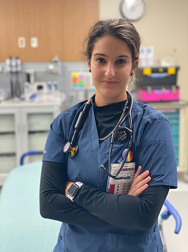 Photo of Summer Amrou, who is graduating Dec. 14 with a bachelor of science degree in nursing, in her nursing uniform.