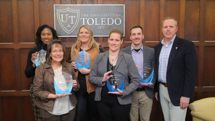 The University of Toledo’s 2024 Outstanding Staff Award winners, from left, Cathy Flanagan, Mary Ann Schuster, Jennifer Villegas, Natalie Bullock, Joe Battelline and Interim President Matt Schroeder.