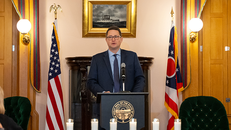 Dr. Barry Jackisch, an associate professor of history and Philip Markowicz Endowed Professor for Judaism and Jewish Biblical Studies, delivers the keynote at a podium at the Ohio Statehouse on Holocaust Remembrance Day.