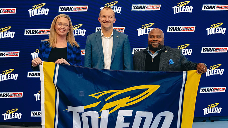 Chris Bailey-Greene (center) was introduced as Toledo's first head coach for Women's Rowing. He is joined by Executive Associate Athletic Director Nicole Alderson (left) and Vice President and Director of Athletics Bryan B. Blair (right).