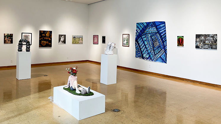 A photo of various art pieces on display in the 2025 Juried Student Exhibition.
