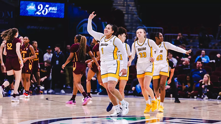 Photo of Toledo women's basketball players Nan Garcia (1) and Sammi Mikonowicz (33) celebrating after the pair combined for 34 points in Toledo's 76-58 win over Central Michigan on Wednesday.