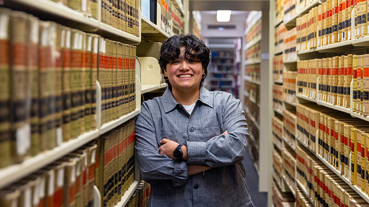 Julie Perez, who graduates in May 2026 from the College of Law, poses for a photo in the UToledo Law Library.