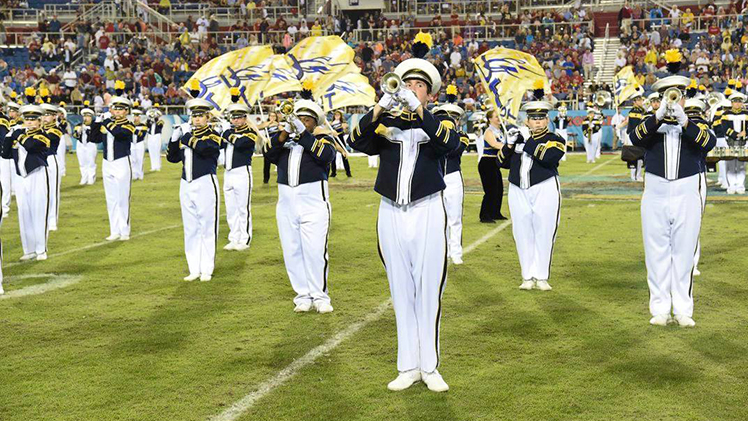 Photo of the Rocket Marching Band performing during a game.