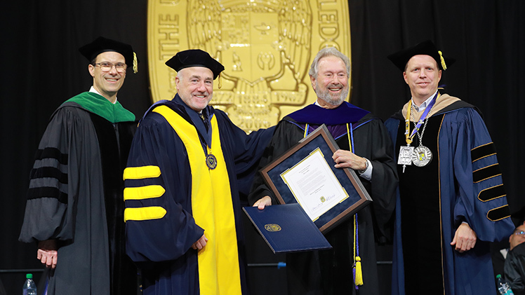 Klar received a doctor of humane letters, honoris causa, at Saturday’s afternoon commencement ceremony. From left, Dr. Scott Molitor, interim provost and executive vice president for academic affairs; UToledo Board of Trustees Chair Patrick J. Kenney; Klar; and UToledo Interim President Matt Schroeder.