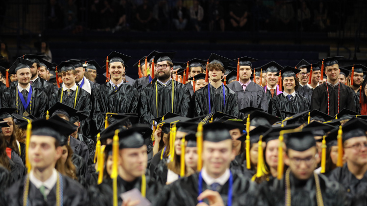 Photo of rows and rows of graduating UToledo students at a spring 2025 commencement ceremony.