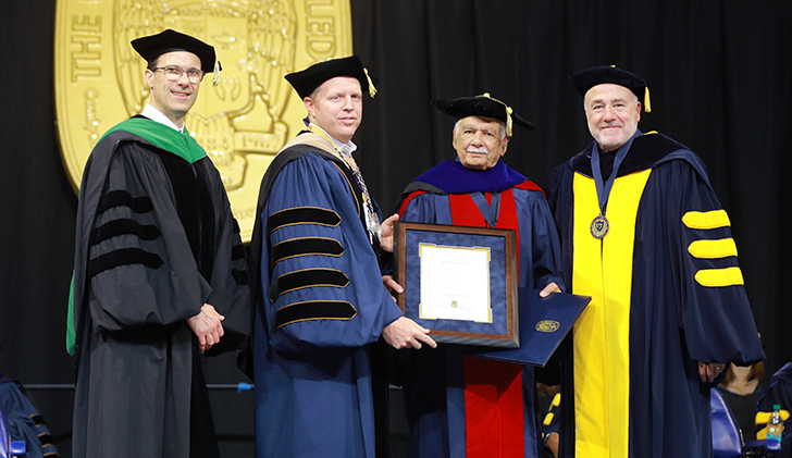 Dr. S. Amjad Hussain, a professor emeritus of thoracic and cardiovascular surgery and a former UToledo Board of Trustees member, received a doctor of humane letters, honoris causa, at the morning undergraduate ceremony. From left, Dr. Scott Molitor, interim provost and executive vice president for academic affairs; UToledo Interim President Matt Schroeder; Hussain; and UToledo Board of Trustees Chair Patrick J. Kenney.