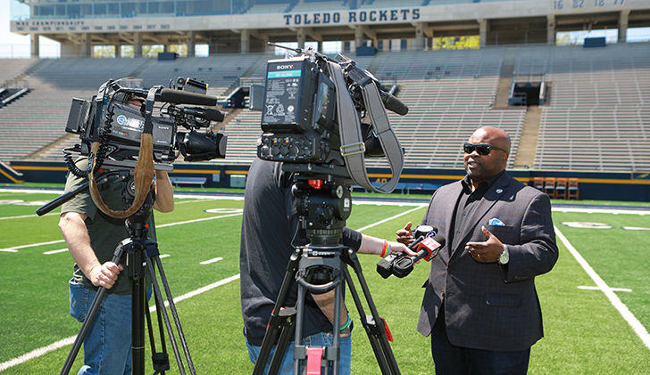 Bryan Blair, vice president for intercollegiate athletics and director of athletics, speaks to local media at a press conference to promote the “Hometown Heroes Glass City Live” concert at the Glass Bowl on Saturday, May 24, which features Zac Brown Band as the headliner.