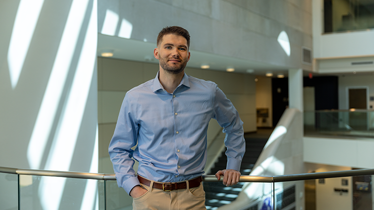 Portrait of Nicholas Henkel, who already earned a Ph.D. from UToledo, will graduate with his medical degree on May 16 and begin a prestigious residency in neurology.