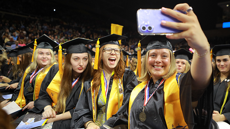 From right to left, Abagail Radabaugh, Courtney Besancon, Shiloh Foltz and Lauren Schaefer pose for a selfie before the morning main commencement ceremony. All four Rockets were graduating with bachelor of science in nursing degrees.