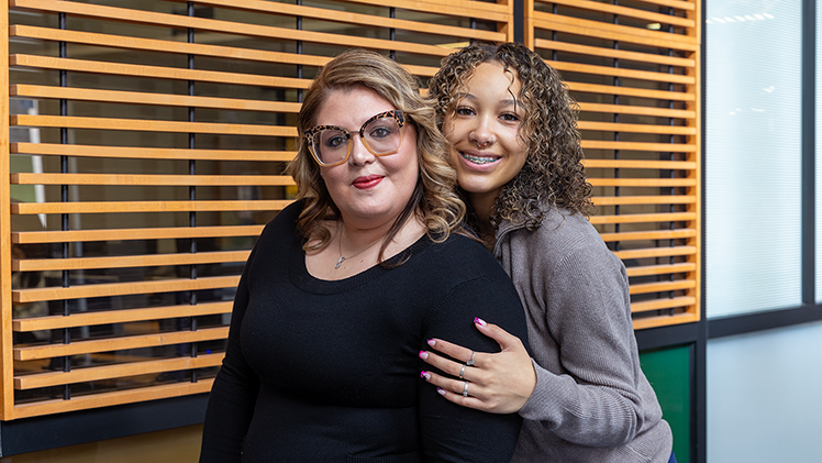 Kayliana Ortiz hugs her mother, Teri Hobson. At Saturday's spring 2025 commencement, Hobson will receive a bachelor of science in nursing and Ortiz, a senior at Toledo Early College, will receive her associate’s degree in general studies.
