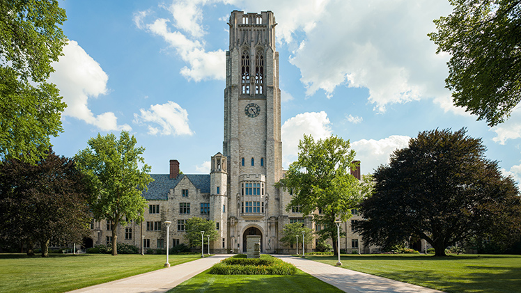 Main Campus beauty shot of the Bell Tower and University Hall on a sunny summer day.