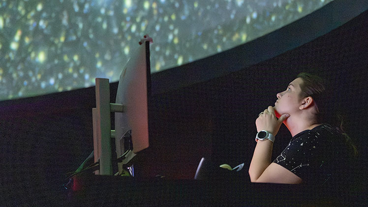 Heidi Westrick, assistant director of Ritter Planetarium, checks out one of the first images from the NSF–DOE Vera C. Rubin Observatory during a Rubin First Look Watch Party at Ritter Planetarium.