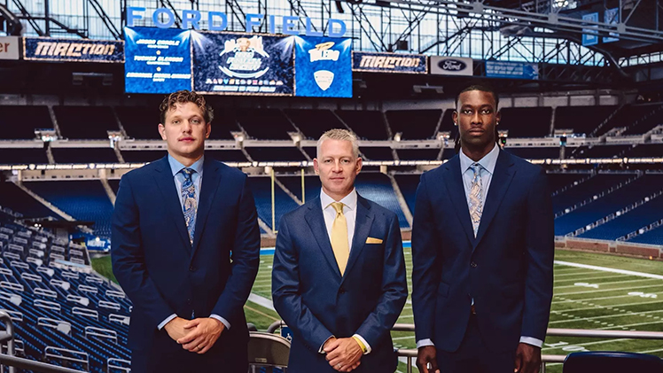 Photo of Toledo Quarterback Tucker Gleason, Head Coach Jason Candle and safety Emmanuel McNeil-Warren at the MAC Football Media Day at Ford Field in Detroit on Thursday. 