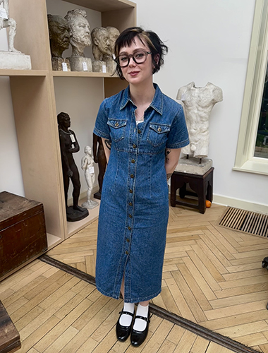 Tatum Hartford, an art history senior, poses next to a little-known sculpture she researched that is in the collection of the Toledo Museum of Art at the Georg Kolbe Museum in Berlin.